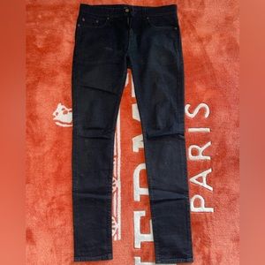 SAINT LAURENT SKINNY-FIT JEANS IN WORN BLACK STRETCH DENIM